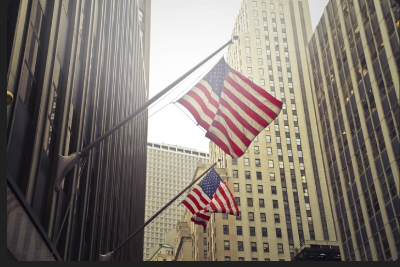 us flag over wall street