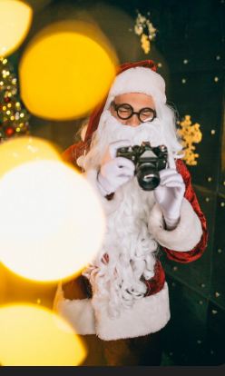 santa with camera under the tree
