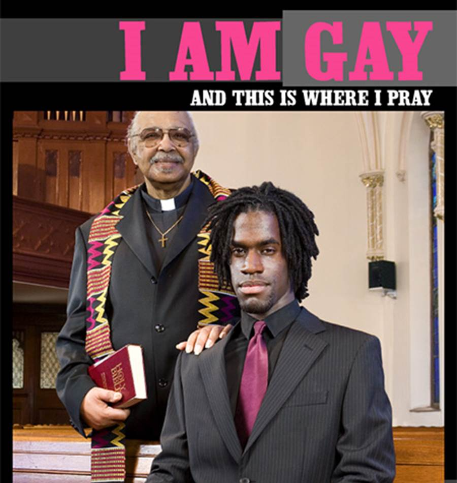clergy man in kente cloth poses holding shoulder of young gay black man
