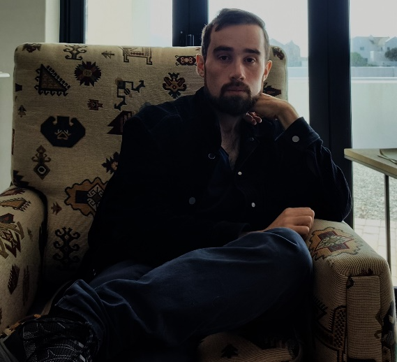 author in chair en repose