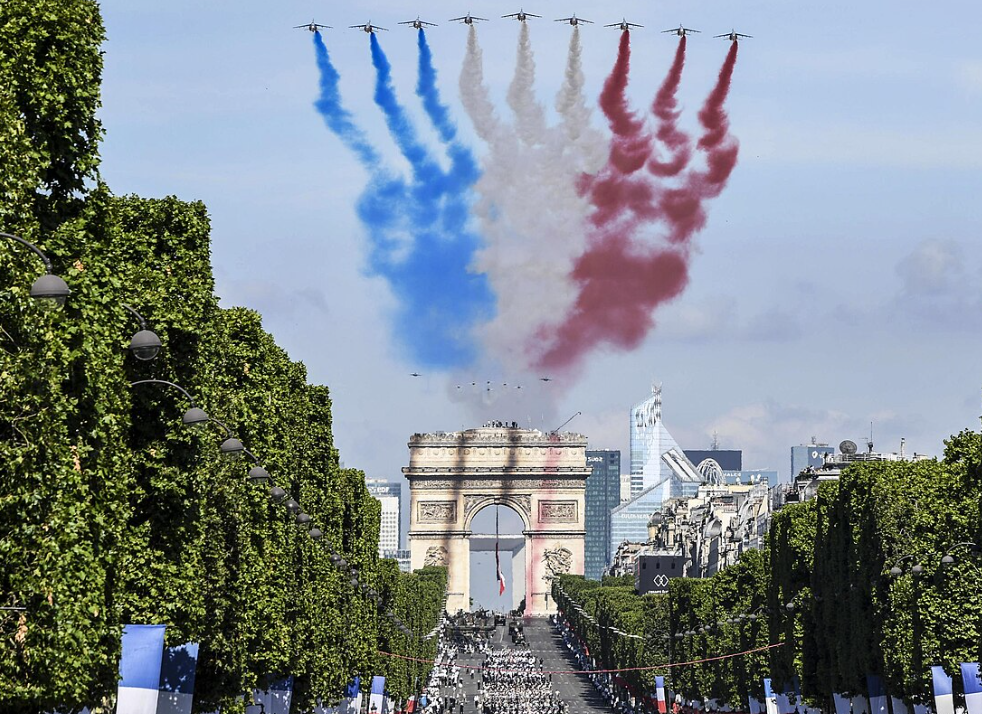 bastille day parade including airplanes with colors