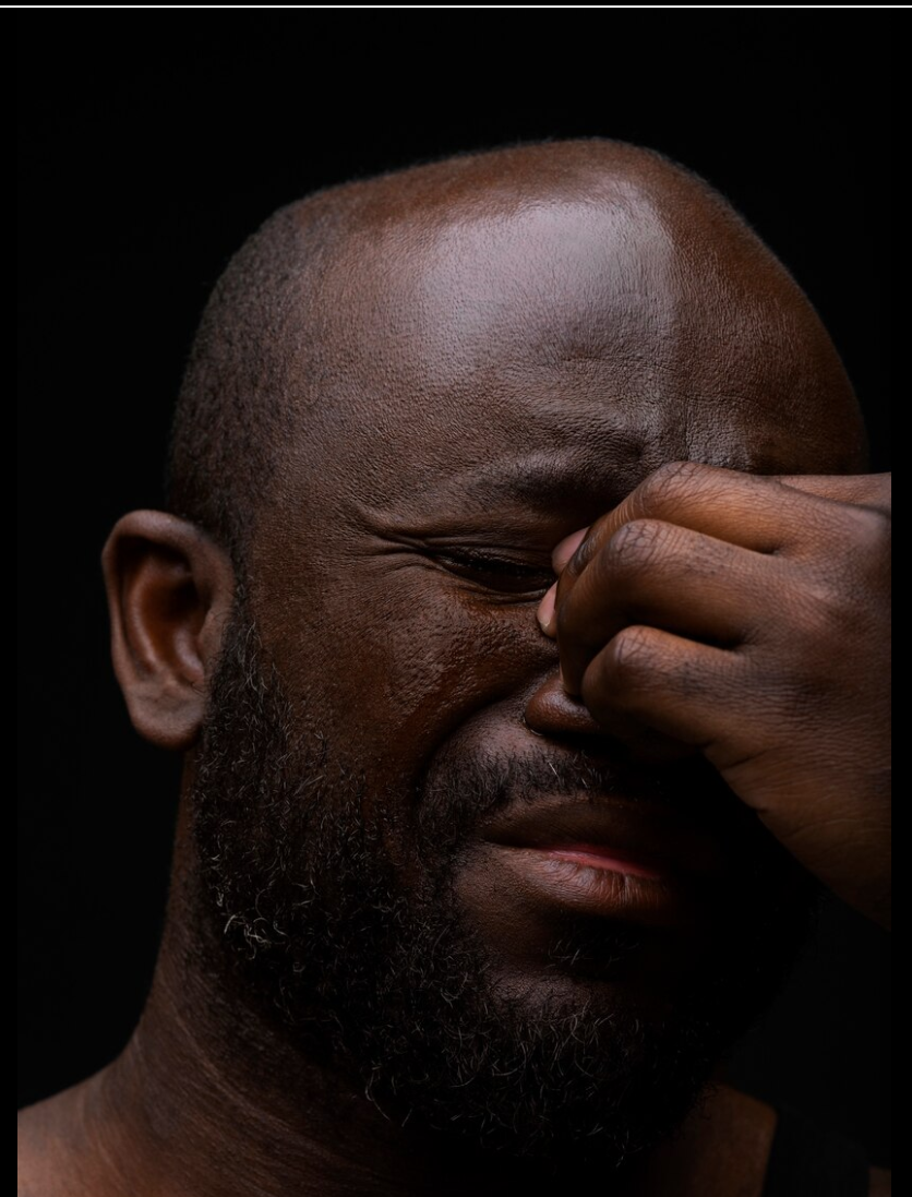 man with headache, closed eyes