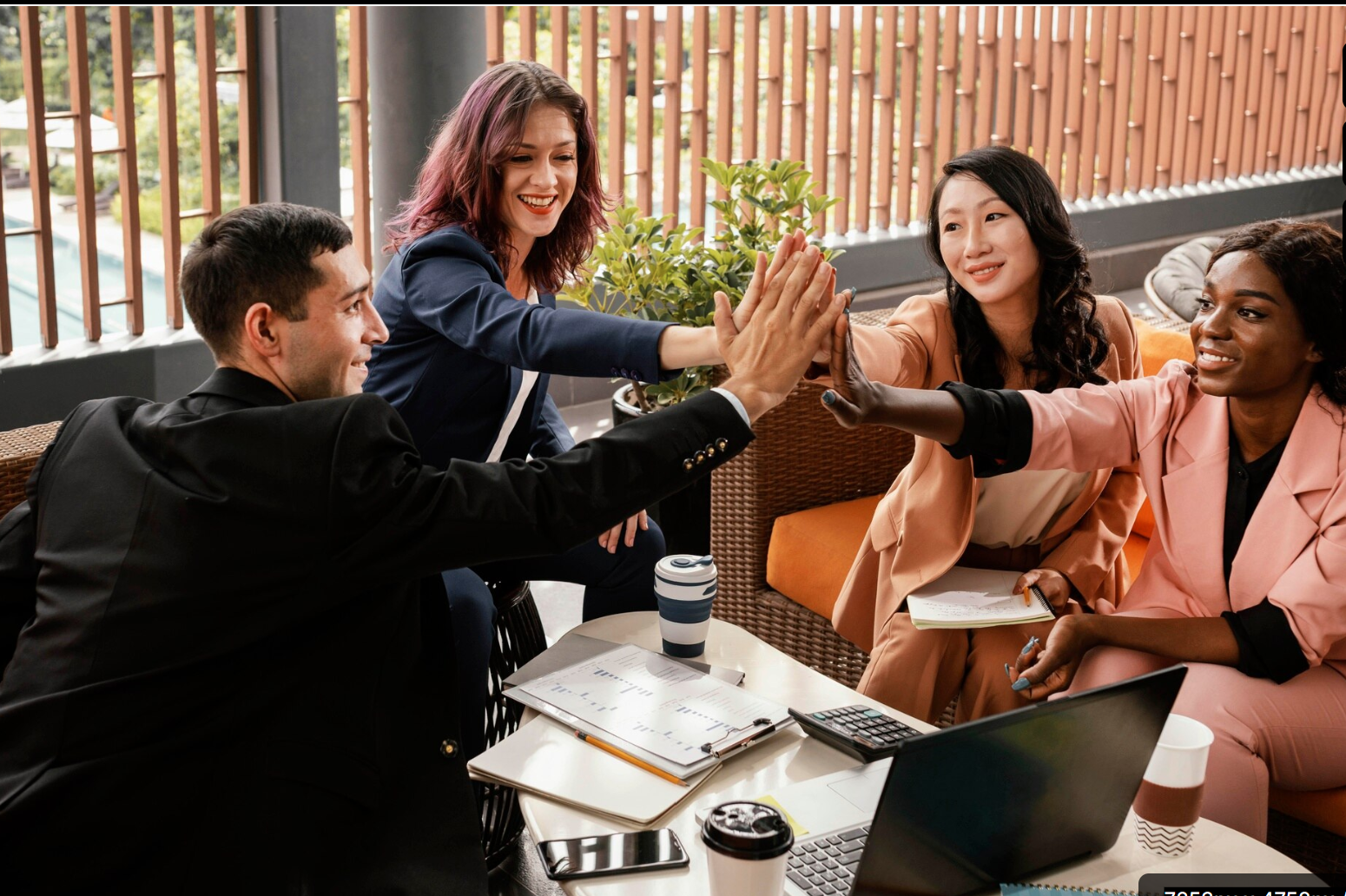 international business group of five hive fiving